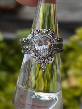 Wear together or separate! Pear-Shaped Halo Ring Set in Silver Tone